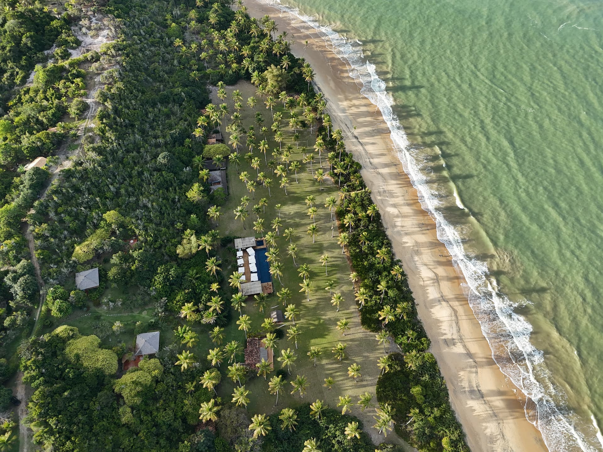 Aerial view of a luxury beachfront villa complex on the Bahia coast